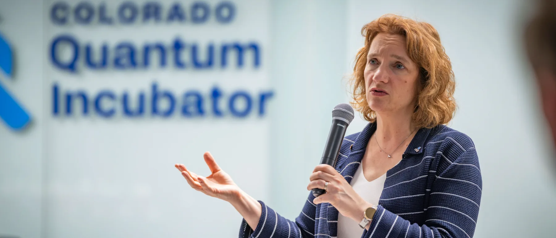 Tanya Ramond, MBA, PhD speaking to a room of founders and researchers at the Colorado Quantum Incubator in Boulder.
