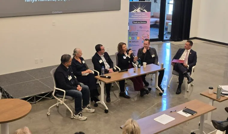 Panel of investors and program directors on stage at the Mountain West Photonics and Quantum International Pitch Competition.